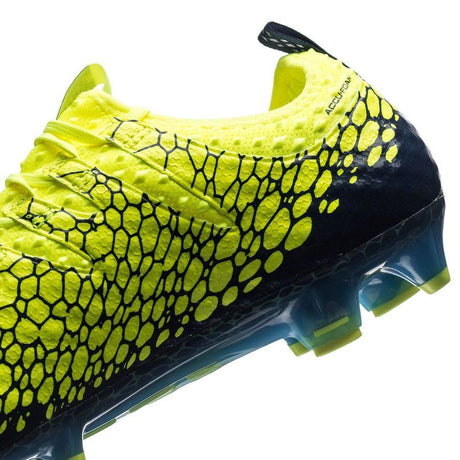 Botines de fútbol PUMA Evopower Vigor 1 Graphic FG para terreno firme - Amarillo seguridad/Plateado