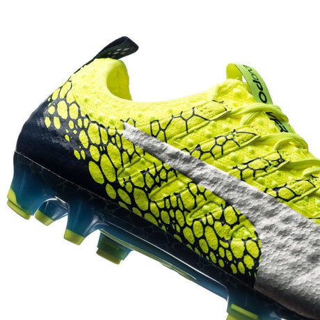 Botines de fútbol PUMA Evopower Vigor 1 Graphic FG para terreno firme - Amarillo seguridad/Plateado