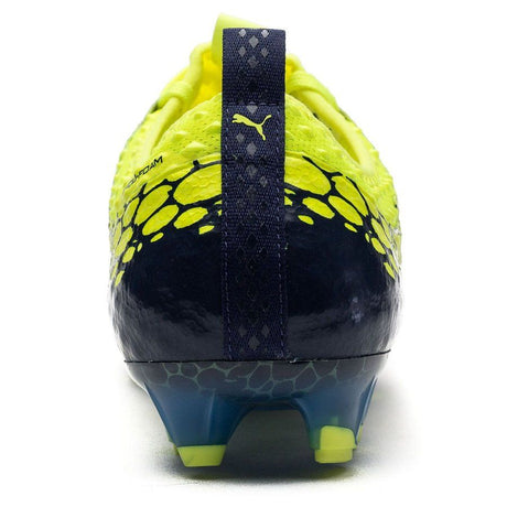 Botines de fútbol PUMA Evopower Vigor 1 Graphic FG para terreno firme - Amarillo seguridad/Plateado