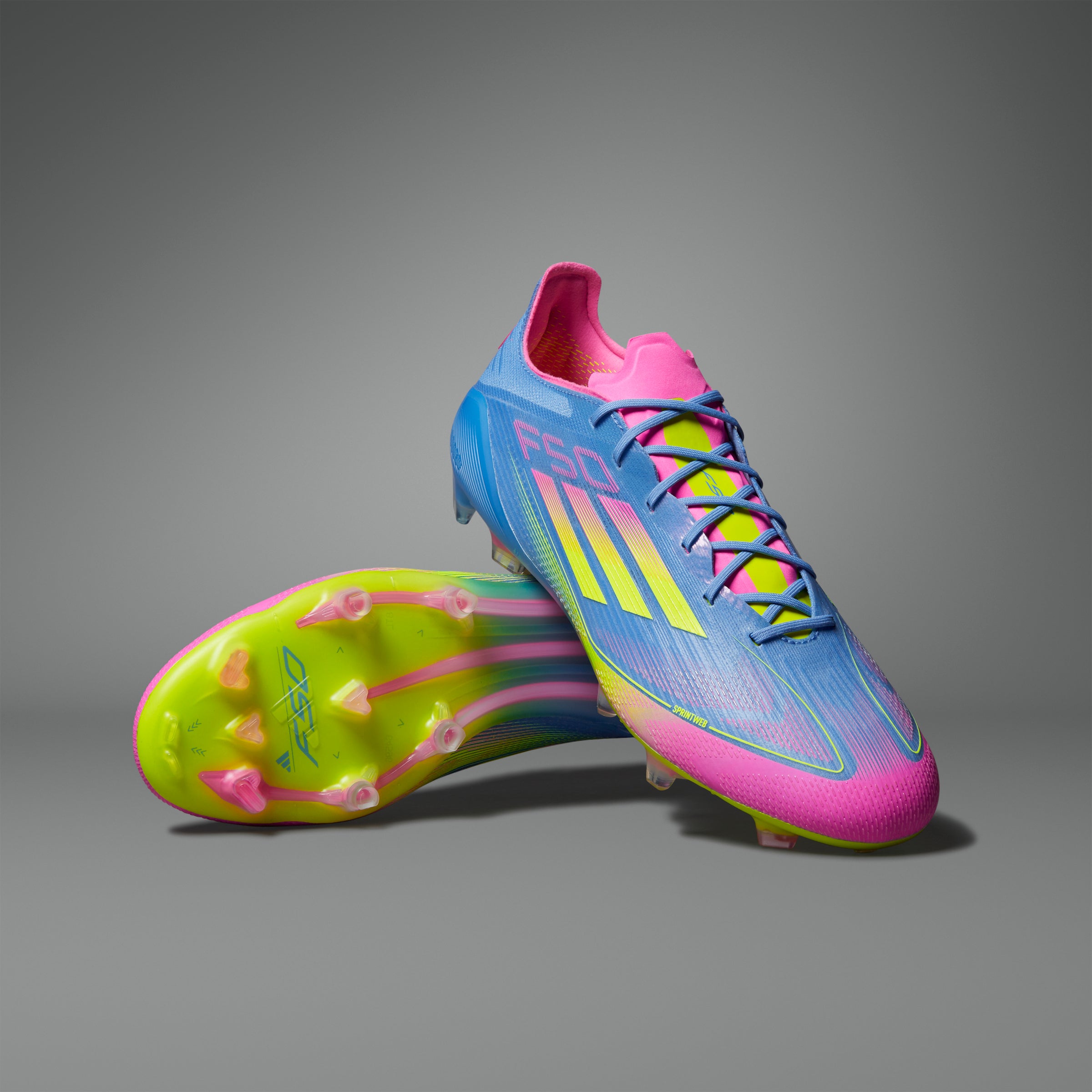 Botas de fútbol para terreno firme adidas F50 Elite en color azul y limón