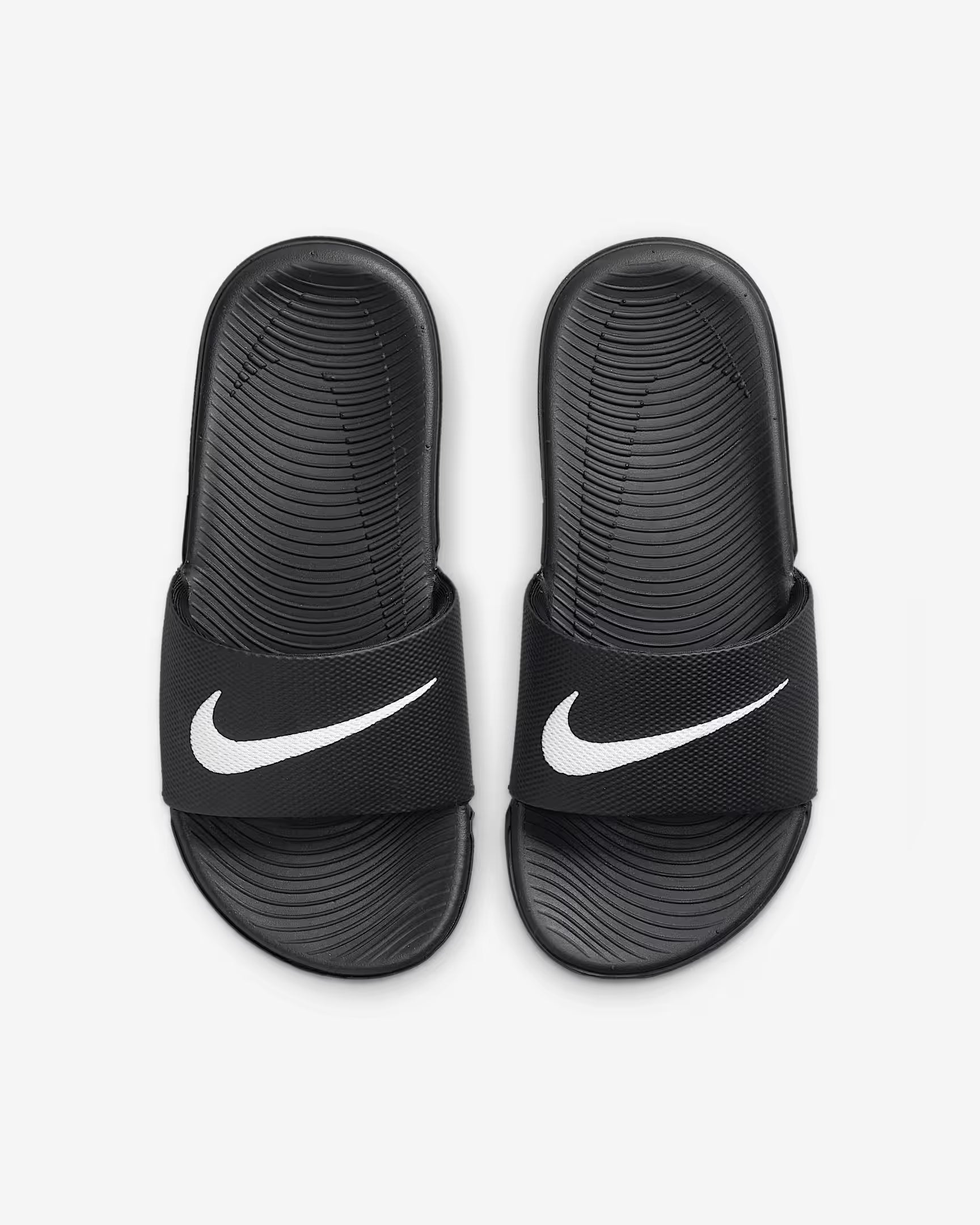 Chanclas Nike Kawa para niños en negro y blanco