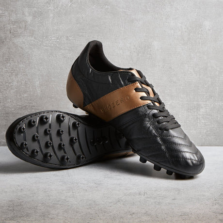 Tacos de fútbol UNOZERO AG Black Modelo 1.0 - Negro