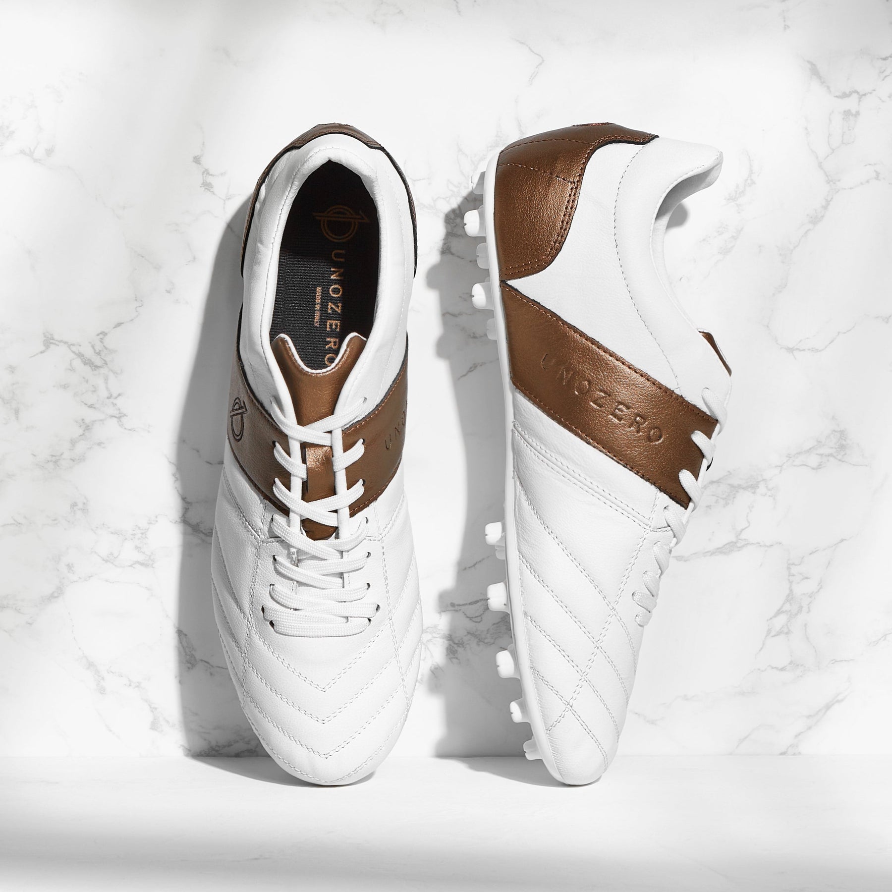 Tacos UNOZERO AG Black Modelo 1.0 - Blanco | Best Buy Soccer