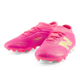 Tacos de fútbol juvenil New Balance Tekela Team Low V5 FG para terreno firme - Rosa Caliente