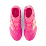Tacos de fútbol juvenil New Balance Tekela Team Low V5 FG para terreno firme - Rosa Caliente